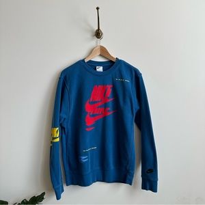 Nike sportswear sport crew in blue with red, yellow and white graphics- S
